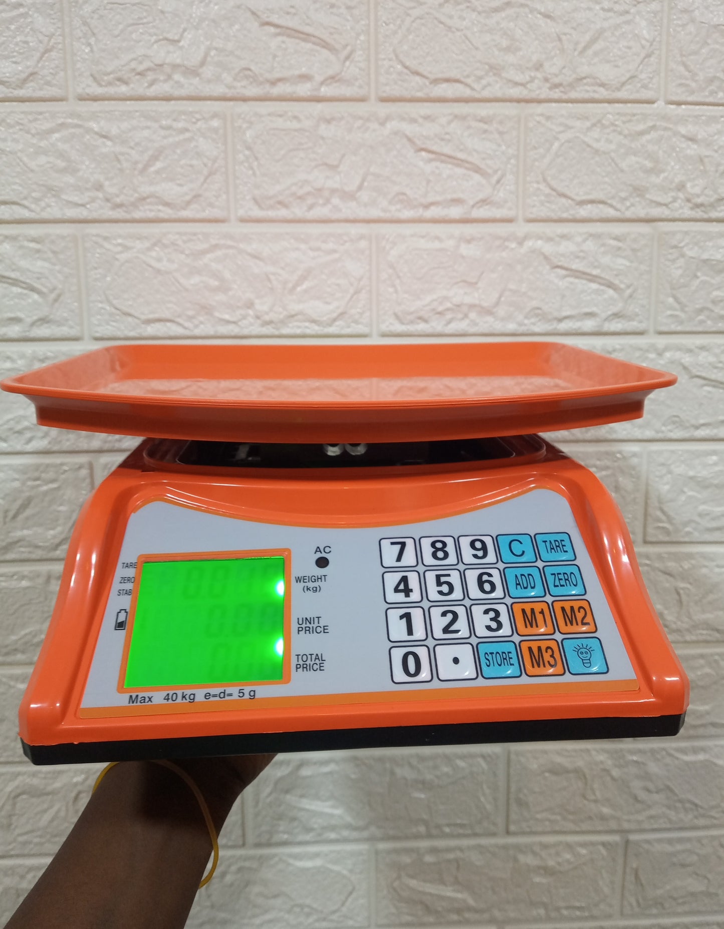 How much is an Electronic Price computing weighing scale orange in Kampala