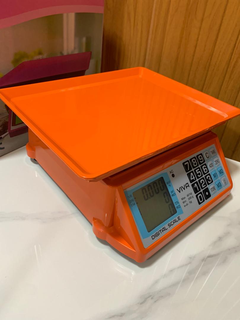 How much are Electronic Price computing weighing scale orange in Kampala