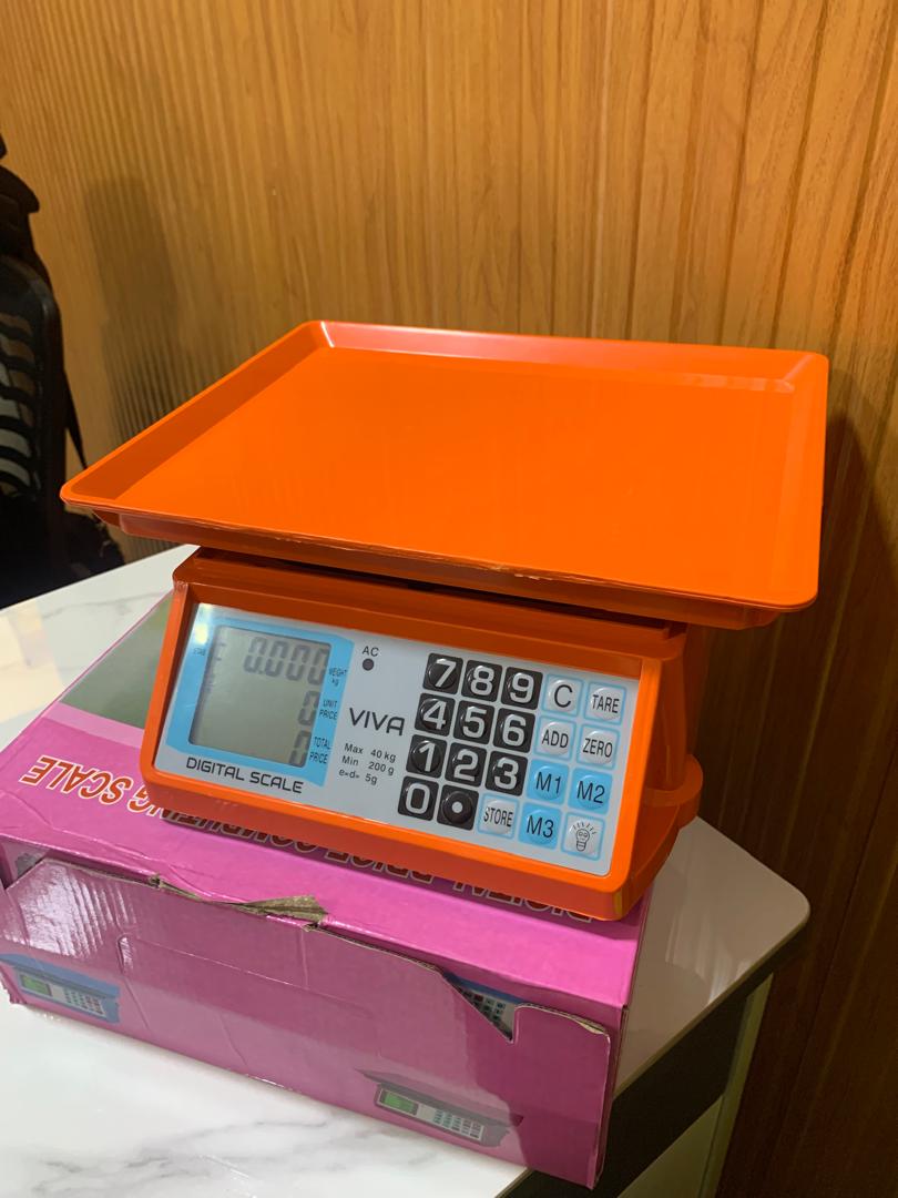 What are the prices of Electronic Price computing weighing scale orange in Uganda