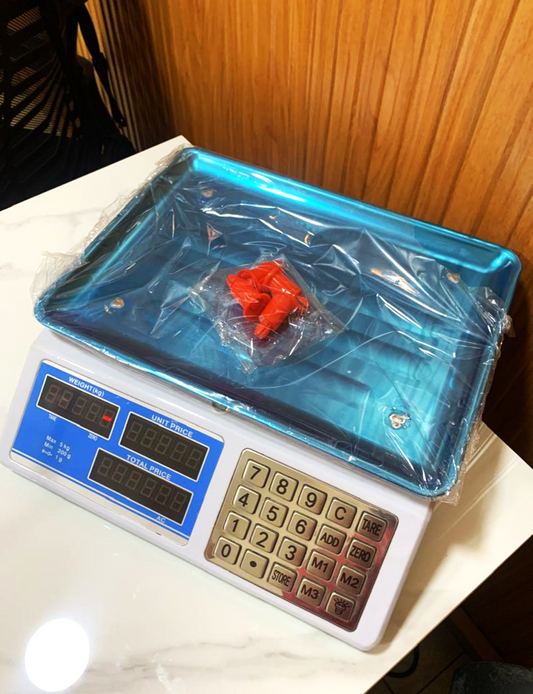 What are the prices of a DT-580 Mini Electronic Computing scales in Uganda