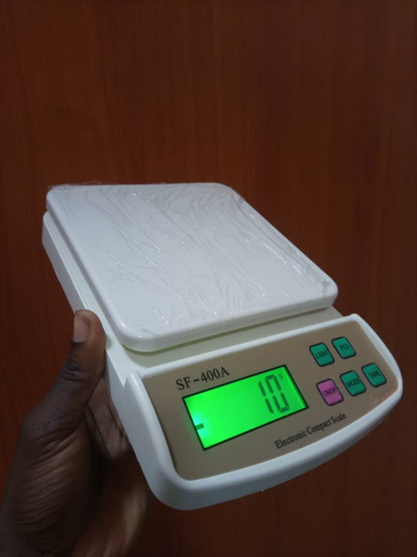 What is the price of Electronic Compact Weighing Scale SF-400A in Kampala