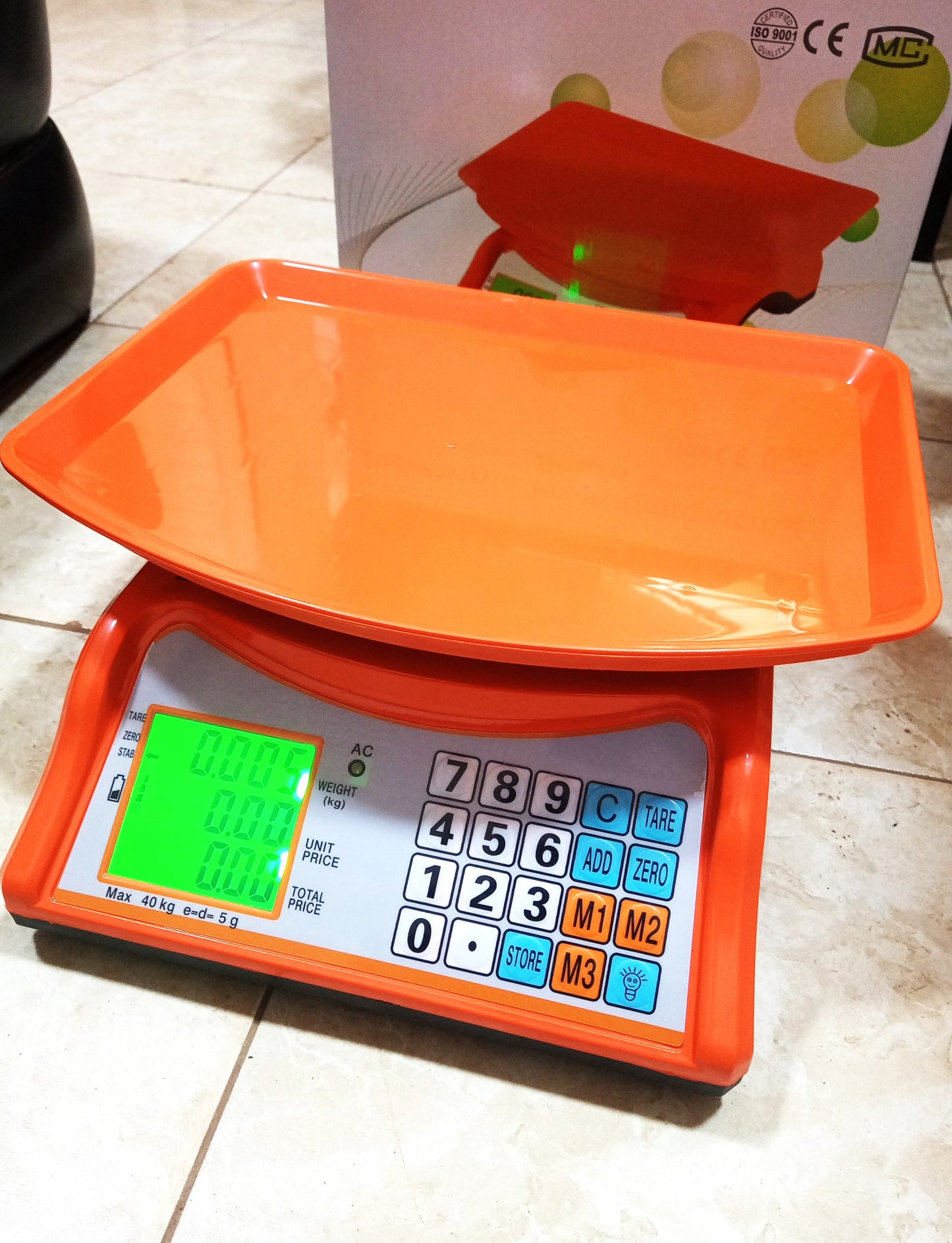How much is an Electronic Price computing weighing scale orange in Uganda
