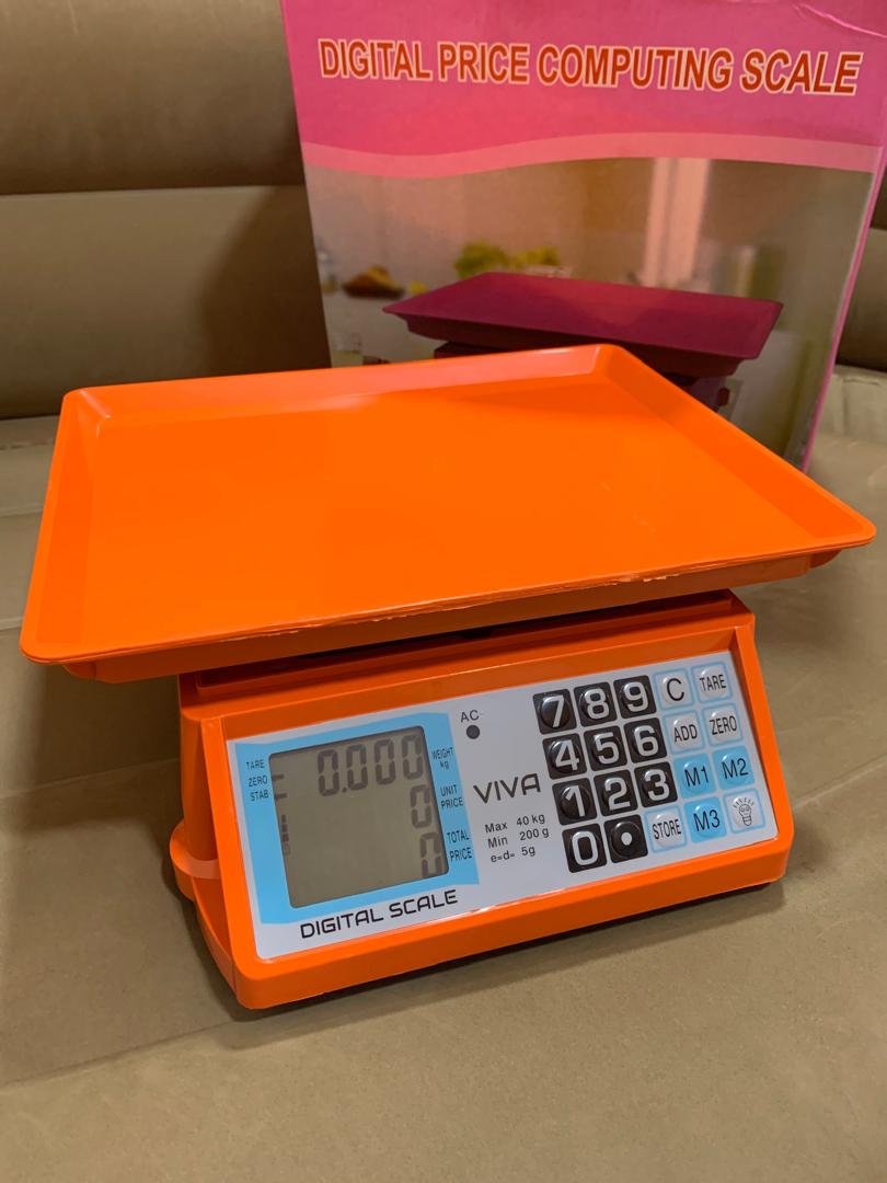 Where to buy an Electronic Price computing weighing scale orange in Uganda