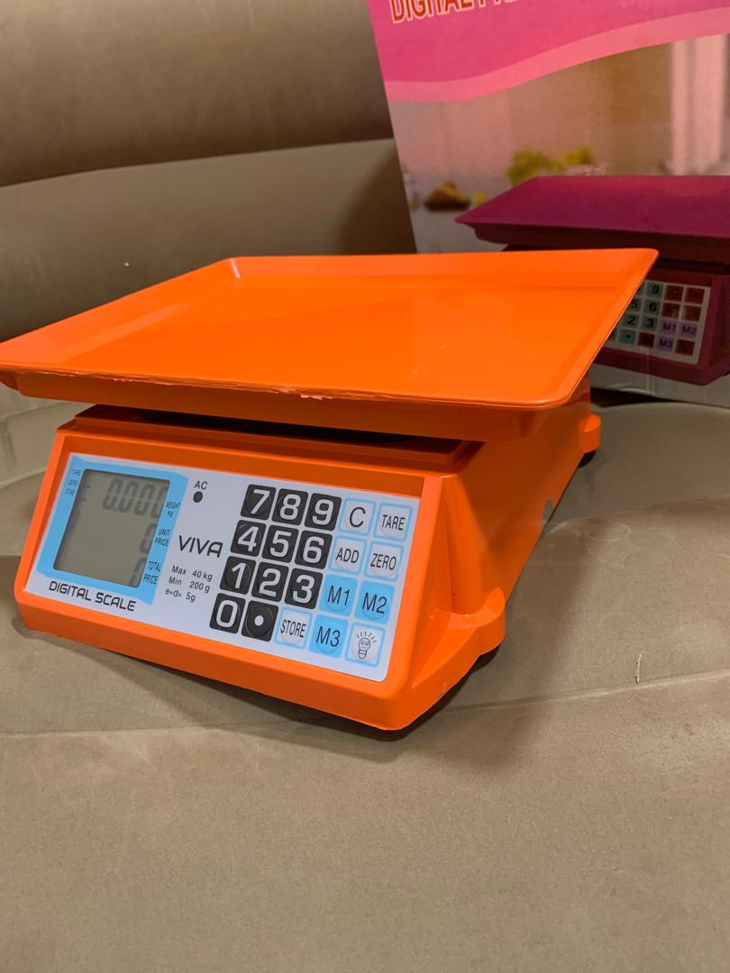 Electronic Price computing weighing scale orange shop in Kampala Uganda