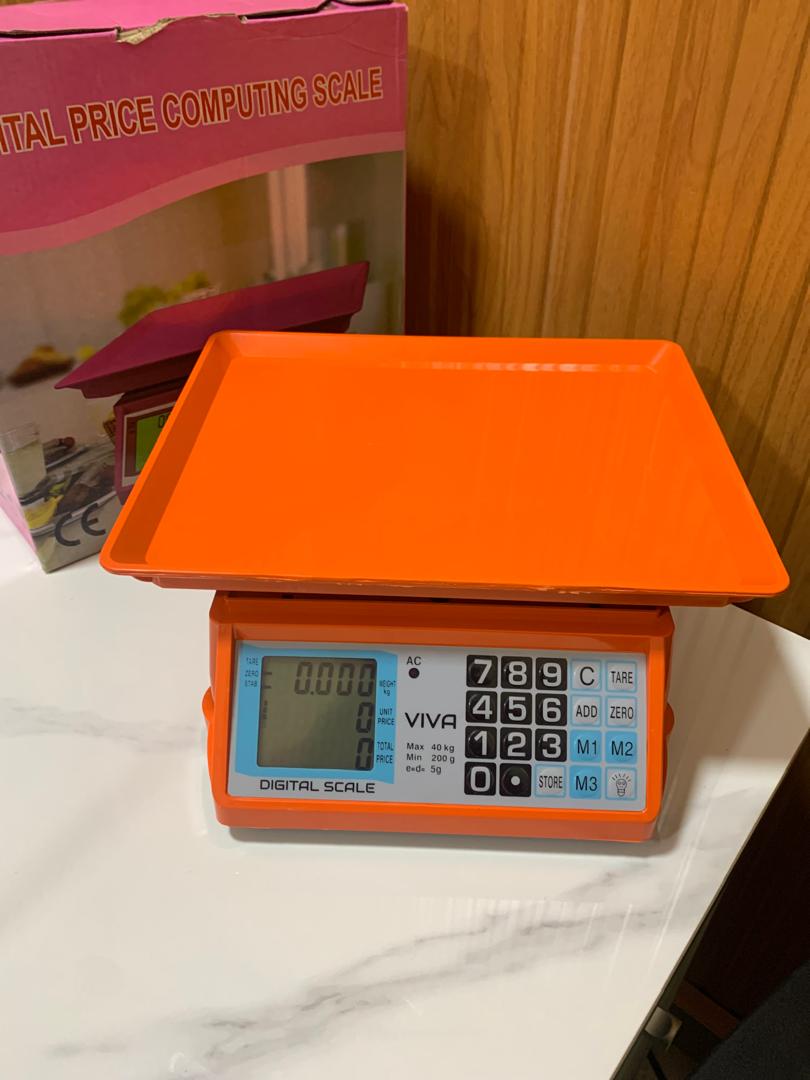 Price of an Electronic Price computing weighing scale orange in Uganda