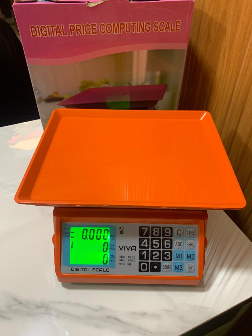 Where can I buy an Electronic Price computing weighing scale orange in Kampala Uganda